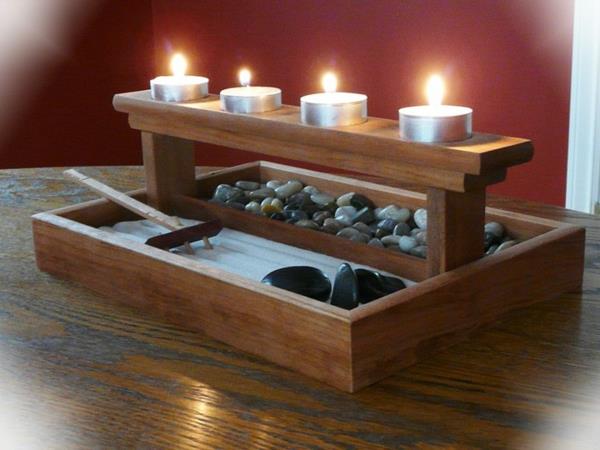 mini-zen-garden-rake-and-four-lit-candles